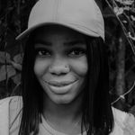Headshot of a smiling woman named Elena.